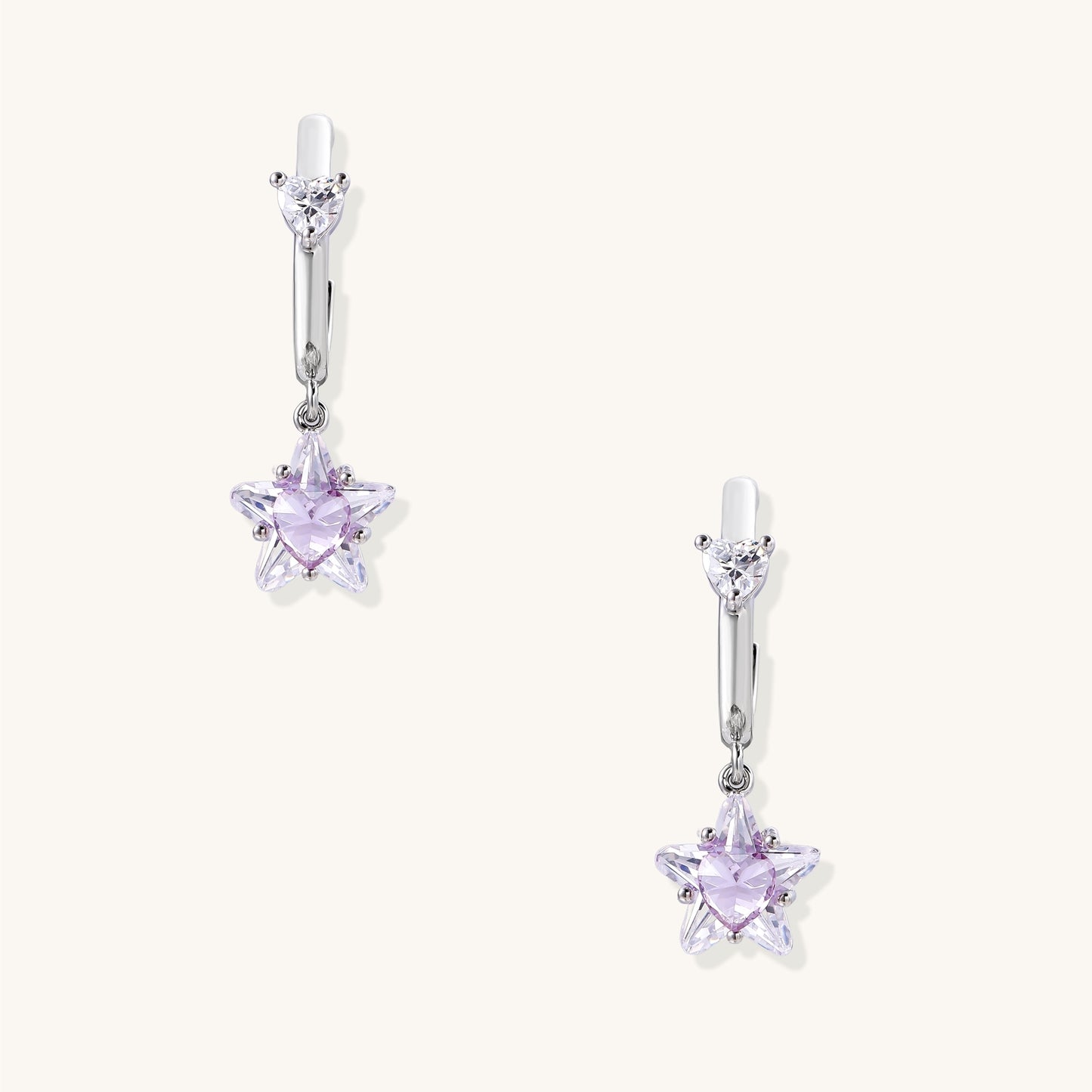 Drop earrings with purple star-shaped zirconia stones and clear teardrop accents in gold-plated brass setting