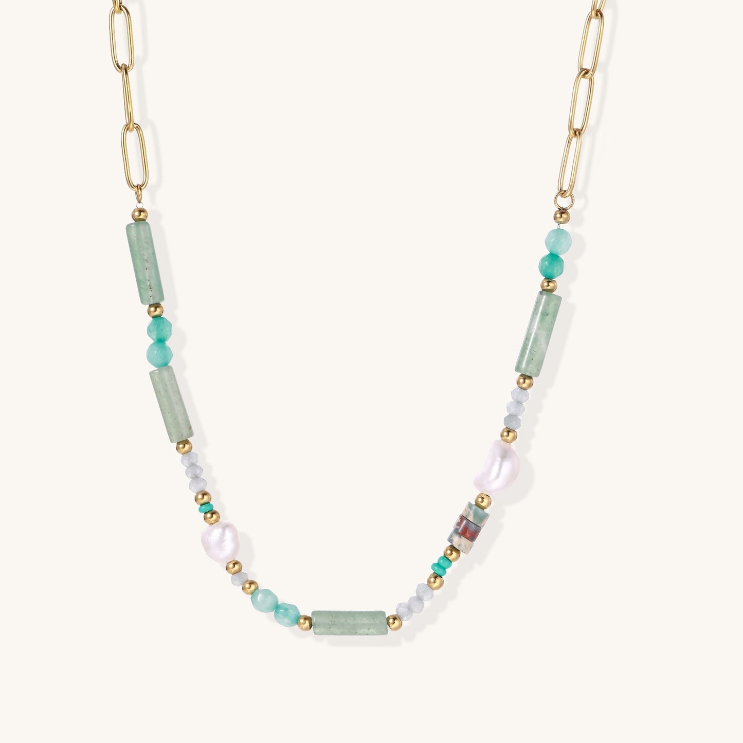 Gold-plated chain necklace with green prasem quartz, freshwater pearls, and mixed beads in modern asymmetrical design