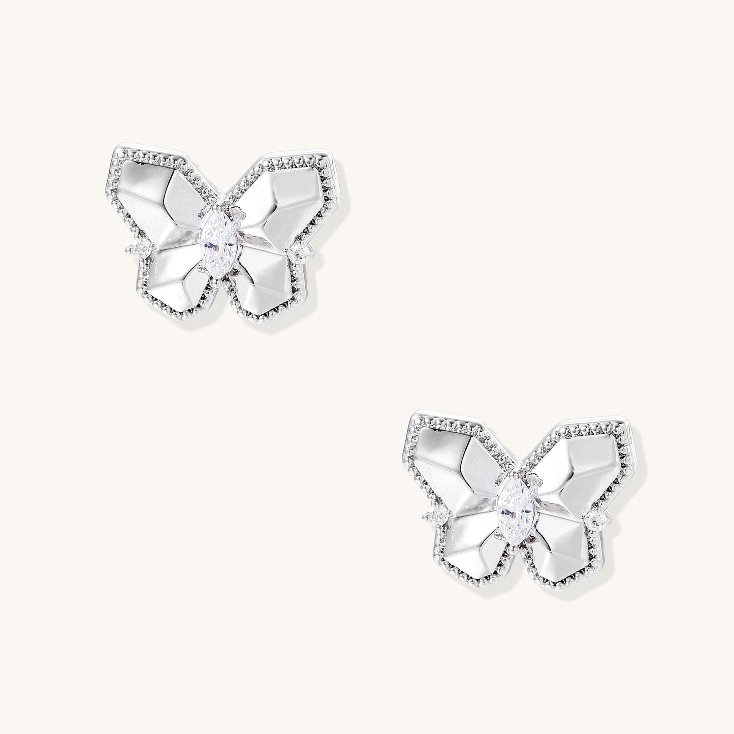 Delicate gold-plated butterfly stud earrings with zirconia crystals outlining wings and marquise center stones