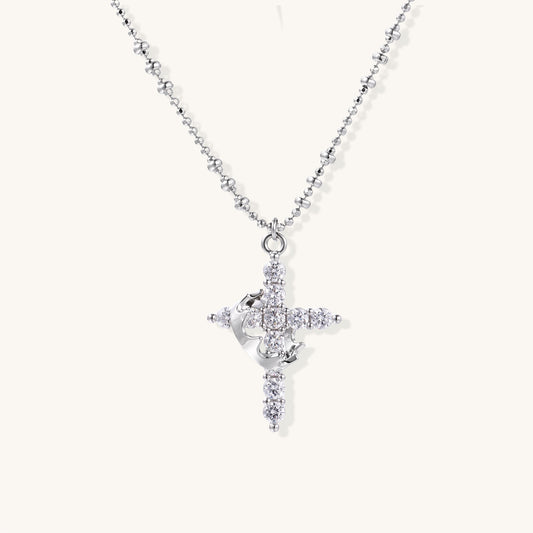Close-up of 18K gold plated cross necklace with zirconia crystals arranged in cross pattern on ball chain