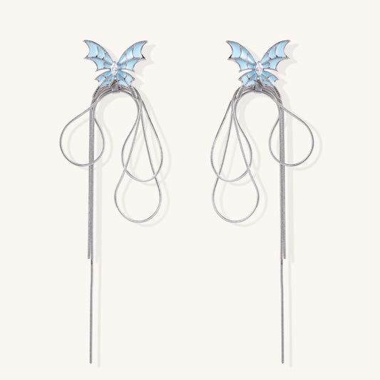 Blue enamel butterfly earrings with cascading gold-plated chains and zirconia crystal accents on white background.