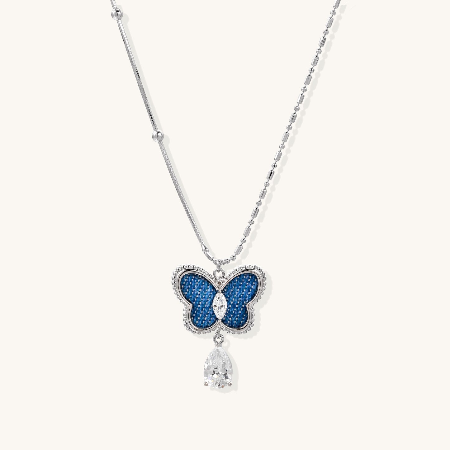 18K gold plated butterfly pendant necklace with blue pavé crystals and dangling teardrop zirconia charm on delicate chain